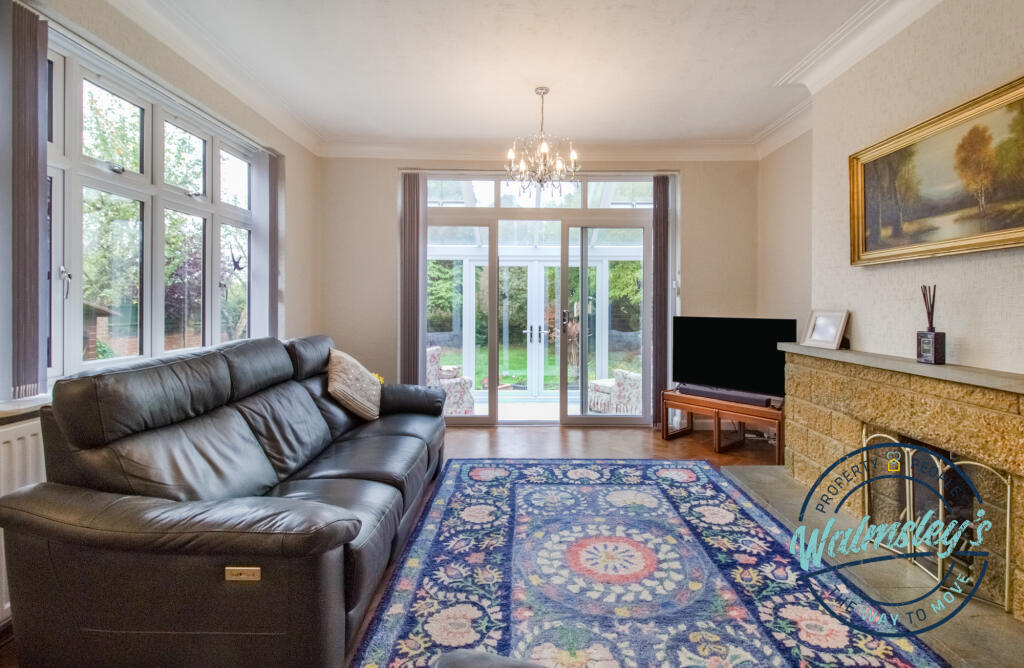 Sitting room with doors to garden room