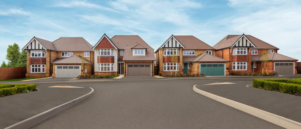 A row of modern detached houses with brown tiled roofs and brick exteriors, situated on a quiet subu