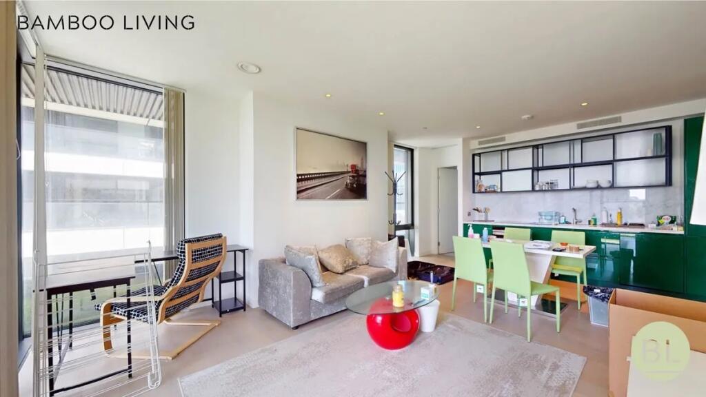 A bright and modern living space featuring larg...