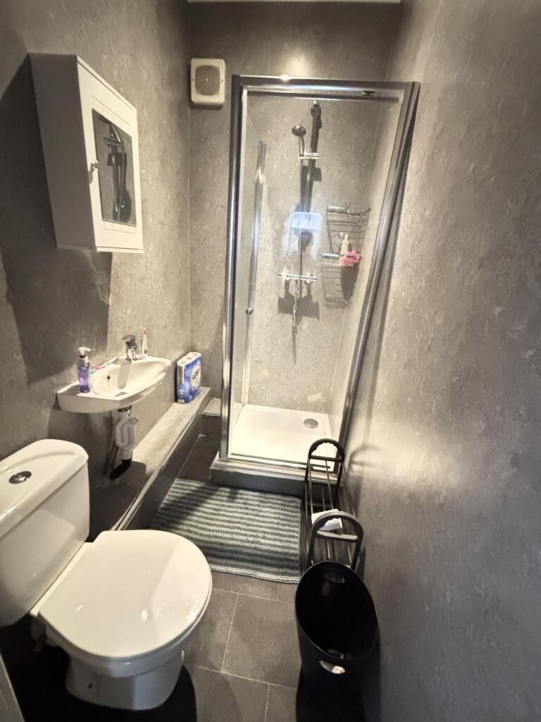 A clean and functional bathroom featuring a toi...