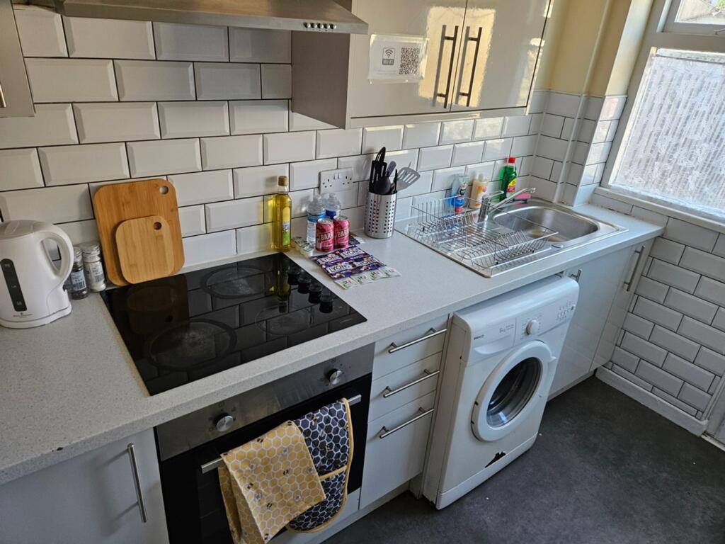 A bright and modern kitchenette featuring ample...