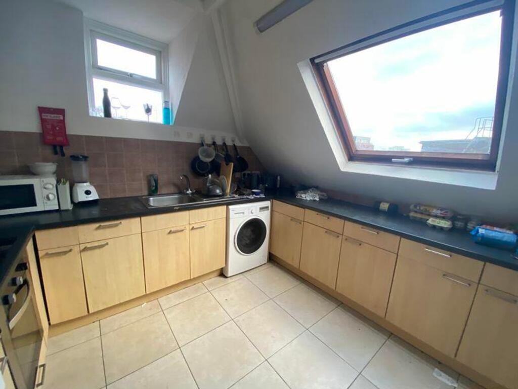 A bright and functional kitchenette with modern...