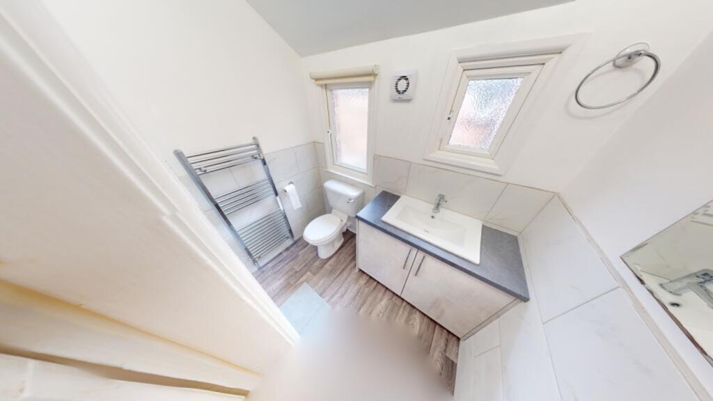 A bright and modern bathroom featuring contempo...