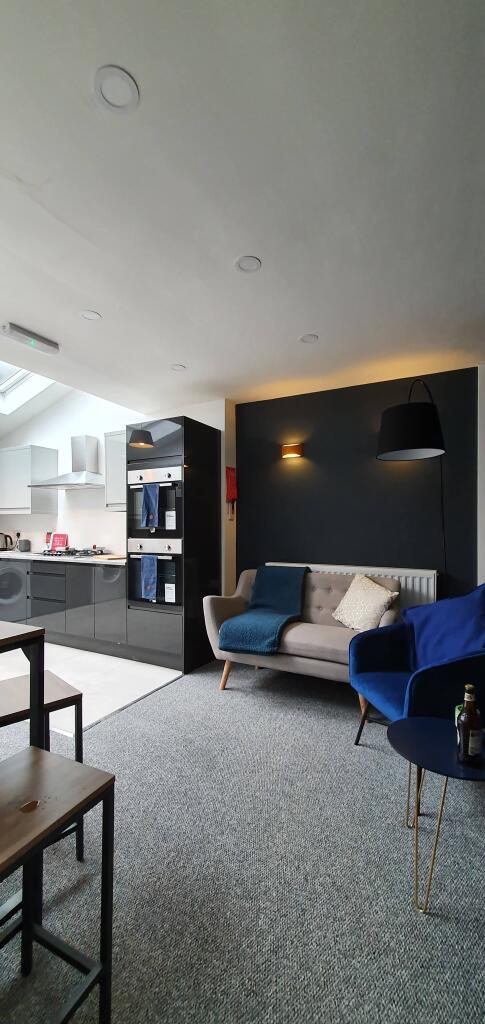 This inviting living room features a stylish so...