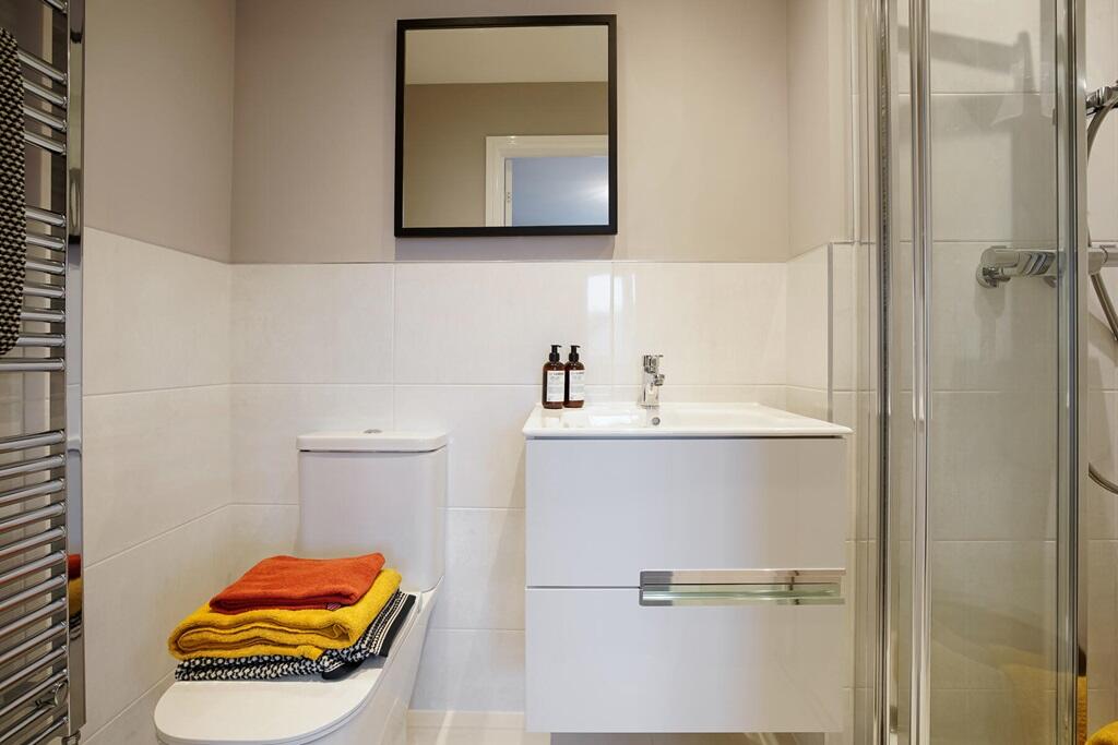 The main bedroom also benefits from it's own en suite shower room