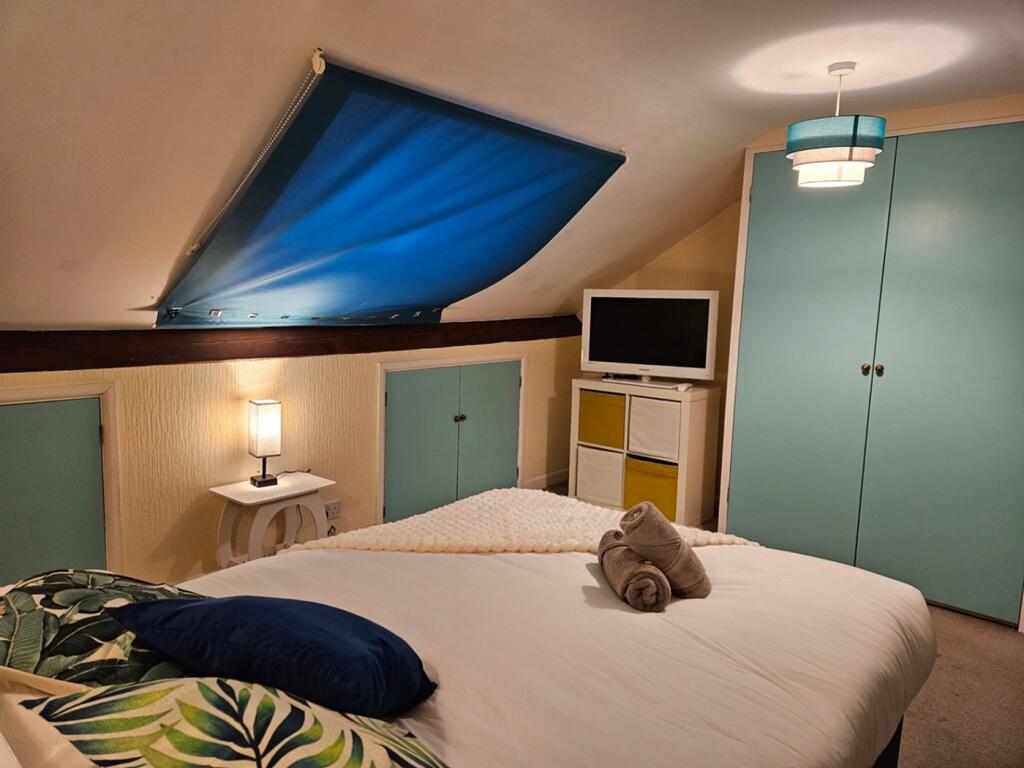 A stylish and inviting double bedroom featuring...
