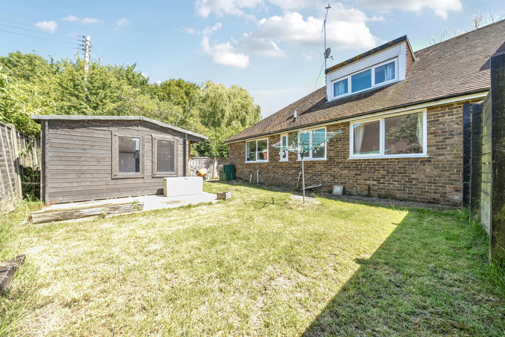 West facing private rear garden and outbuilding with potential to be used as a home office/games room or annnexe