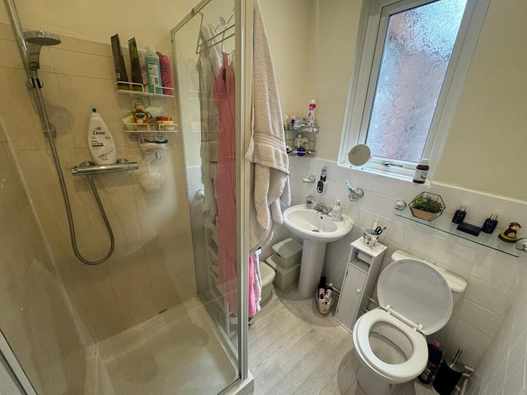 Bright and well-maintained bathroom featuring a...