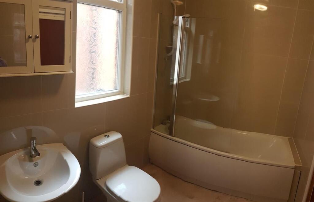 A clean and well-maintained bathroom featuring ...