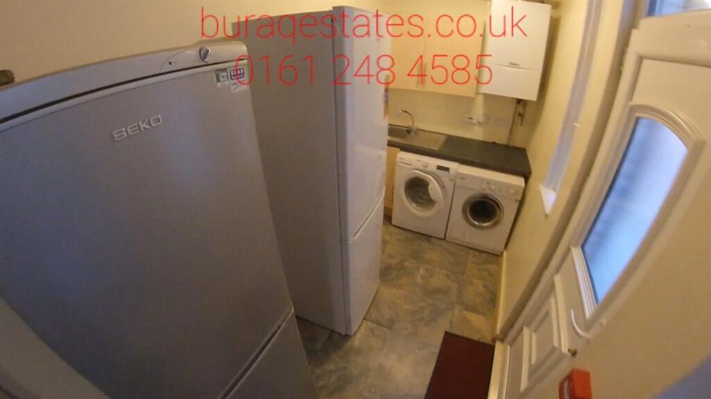 A compact and well-maintained utility/storage a...