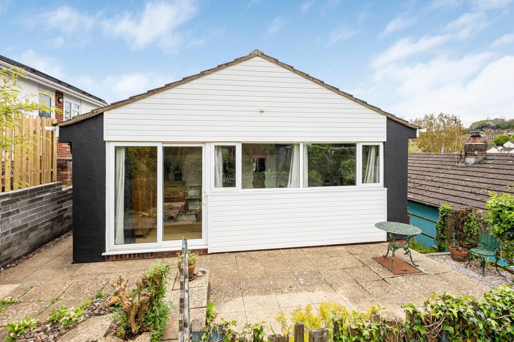 Rear of bungalow with patio doors into main bedroom