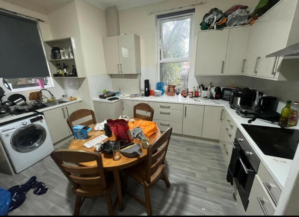 Bright and functional kitchen area with ample s...