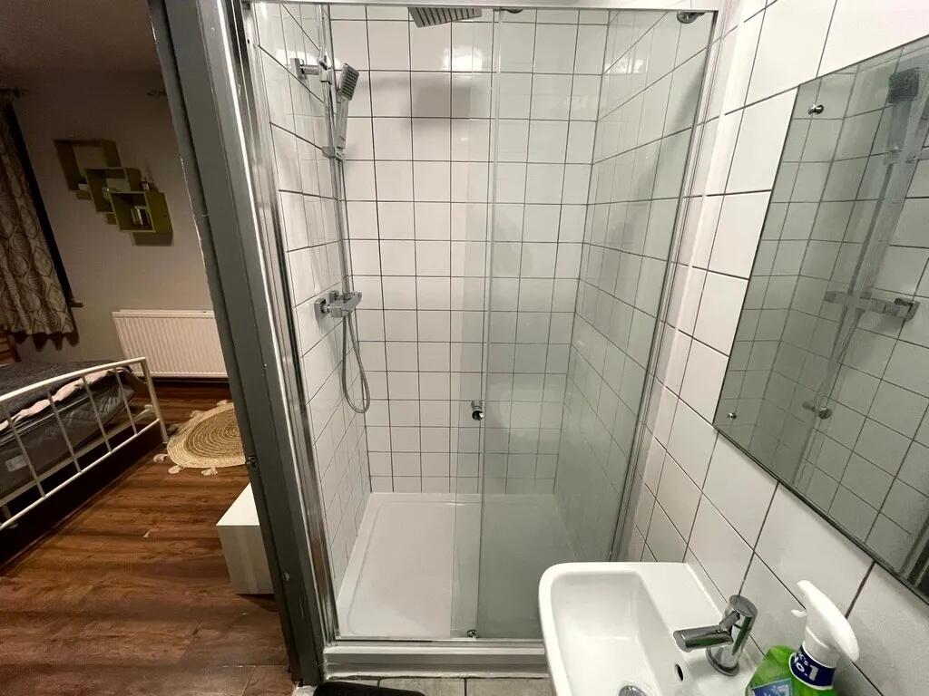 A clean and modern bathroom featuring a spaciou...