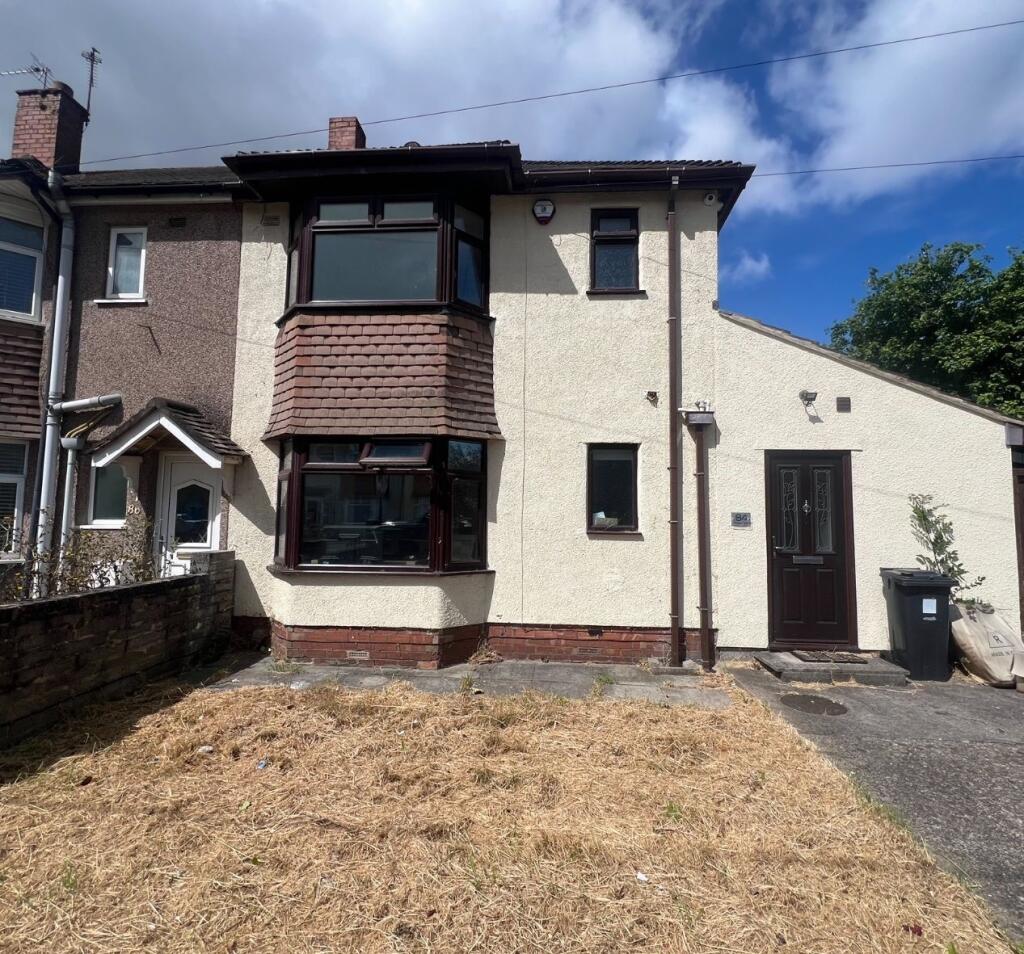 A charming terraced house with classic bay wind...