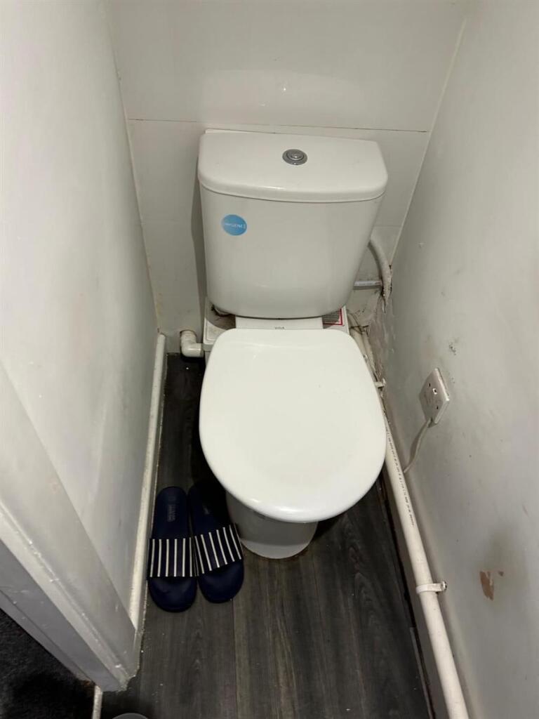 Compact and functional single toilet room with ...