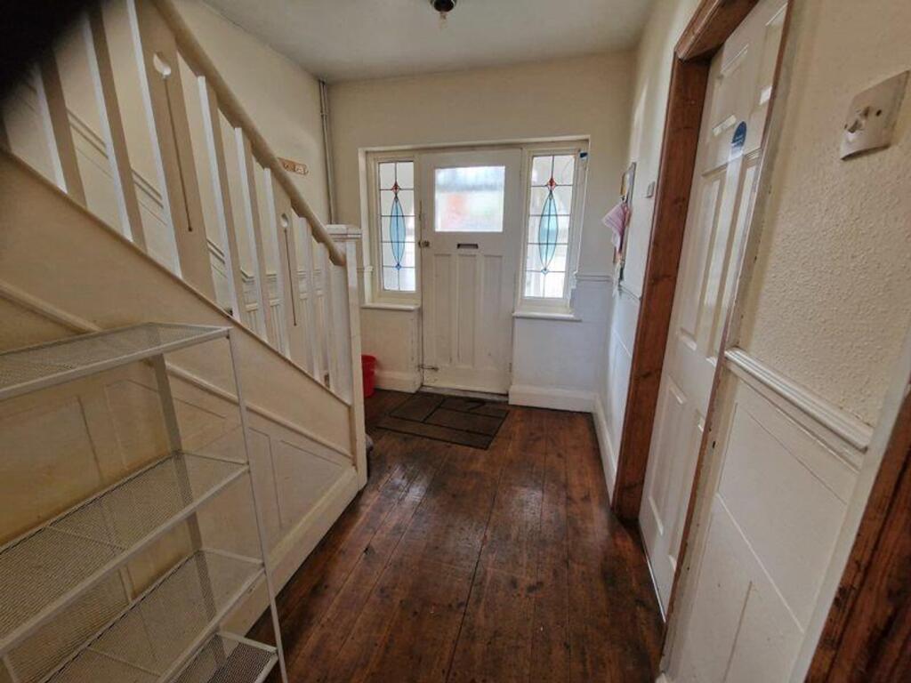 A welcoming hallway with a blend of character a...