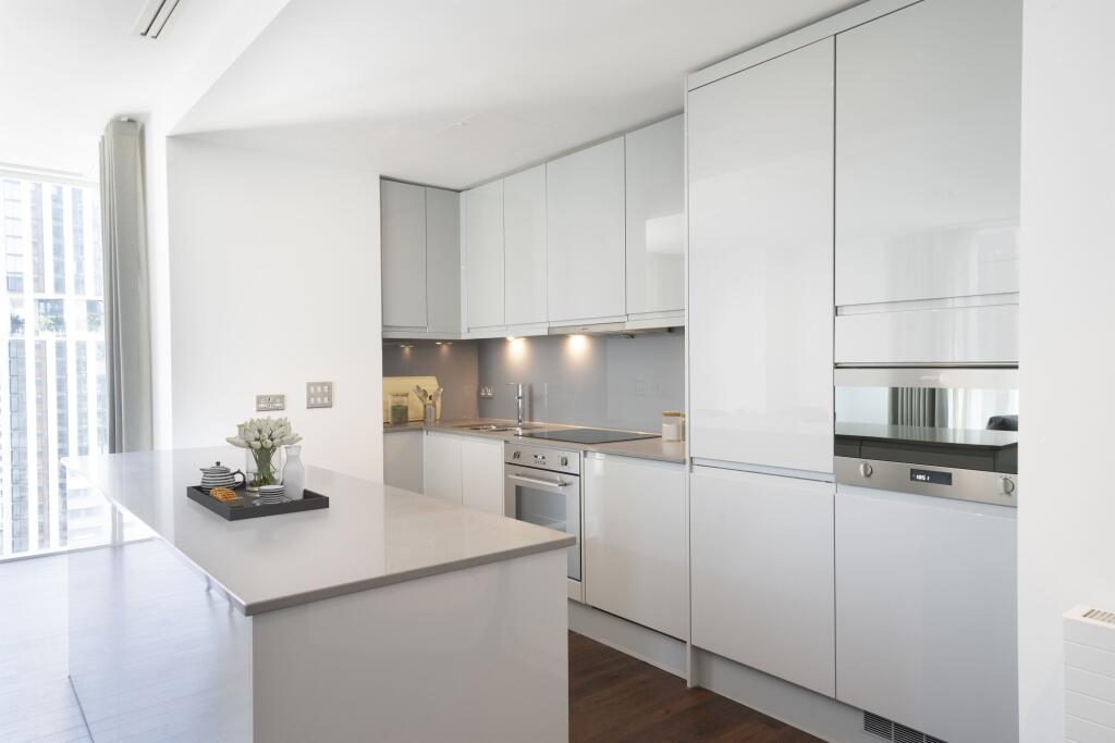 Step into a world of culinary perfection with this sleek modern kitchen, boasting top-notch amenities and stylish design.