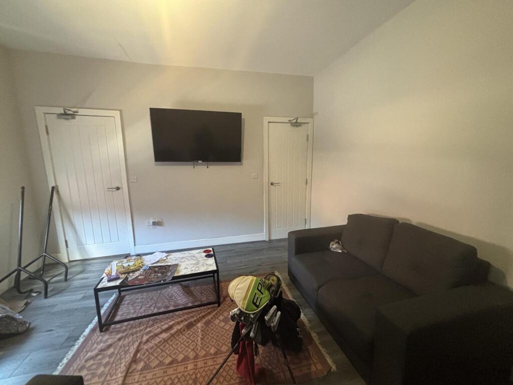 A bright, welcoming living room featuring a com...