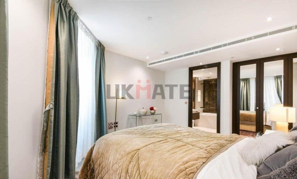 Bright and spacious master bedroom featuring a ...