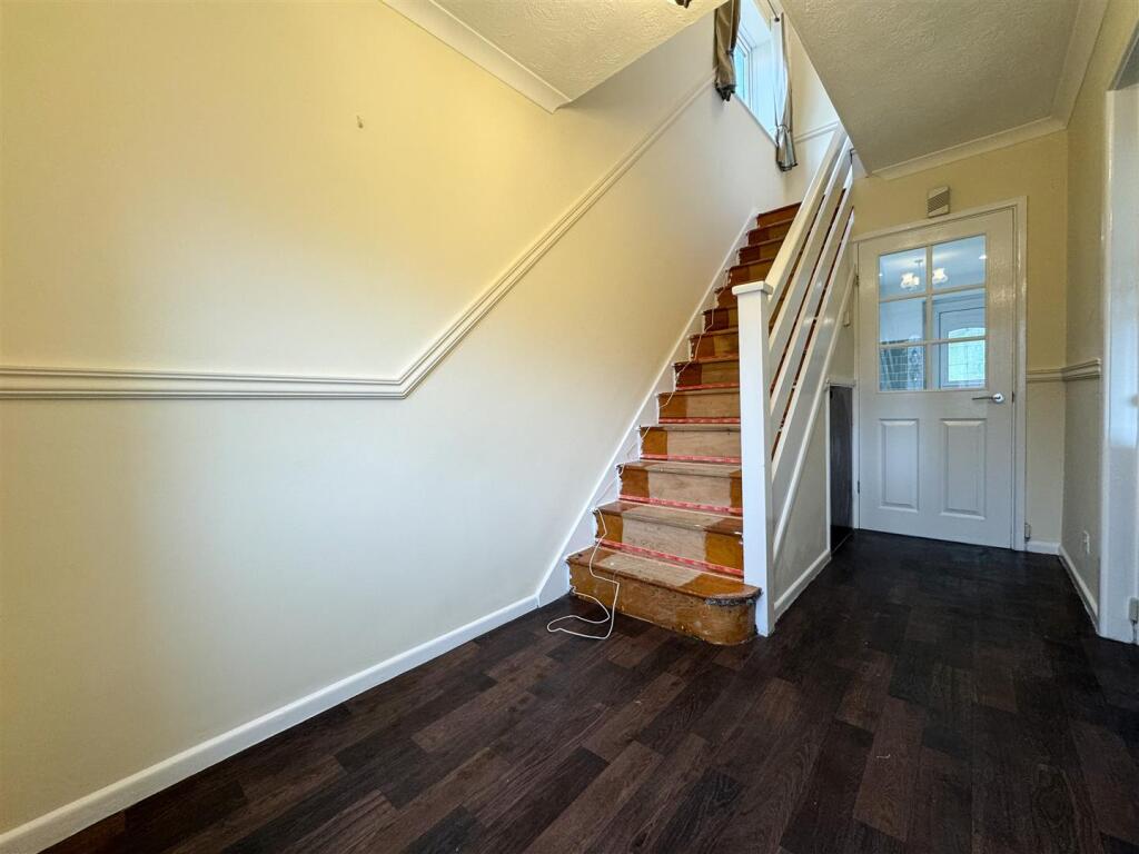 STAIRS RISING TO THE FIRST FLOOR