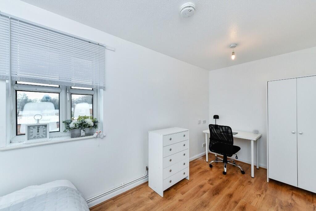 A bright and spacious double bedroom featuring ...