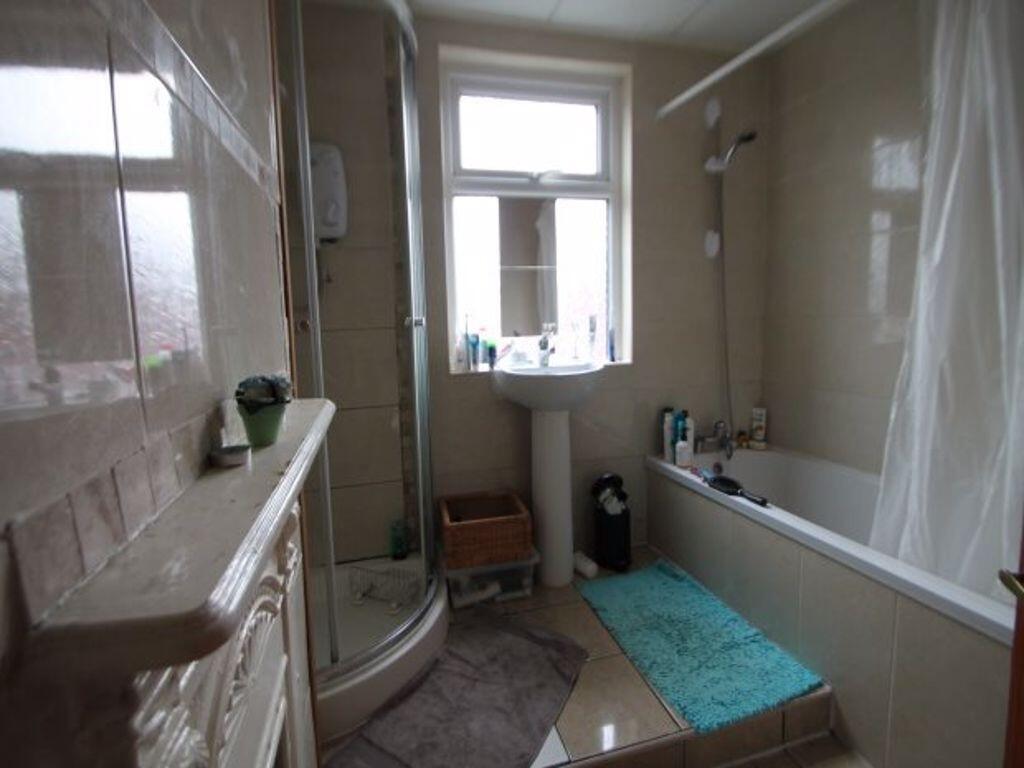 A well-maintained bathroom featuring both a bat...