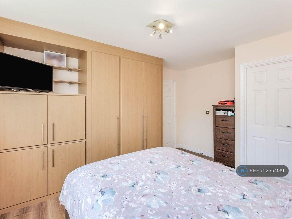 The Master Bedroom With Attached Bathroom