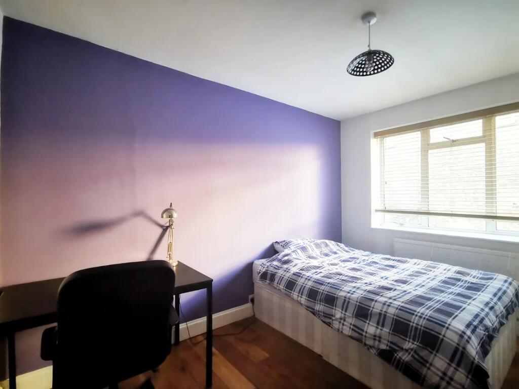 Bright and neat single bedroom featuring a comf...