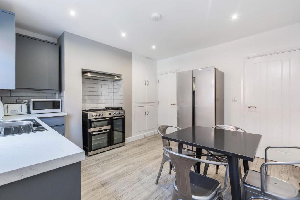 Bright and modern kitchen with ample space, equ...