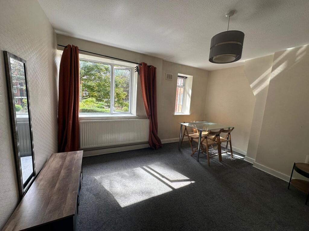 Bright and welcoming living room featuring larg...