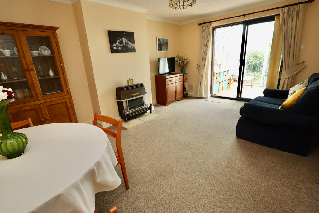 Sitting room with conservatory off