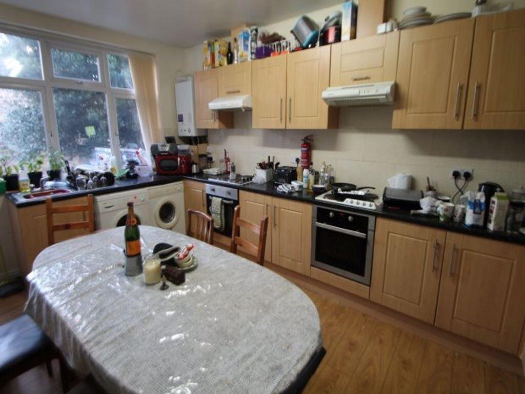 A bright and functional kitchen featuring ample...