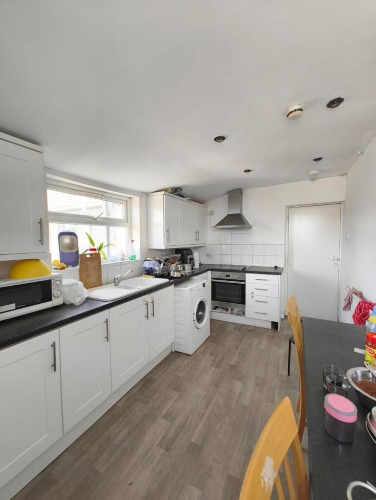 Bright and functional kitchen featuring ample c...