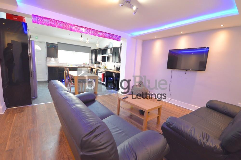 A modern living room featuring comfortable blac...