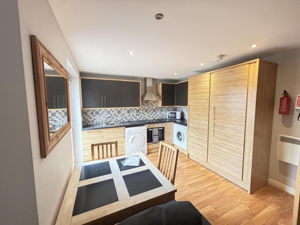 A bright and modern living room featuring a coz...