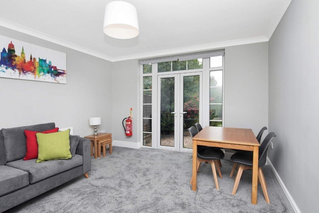 Bright and inviting living room featuring a coz...