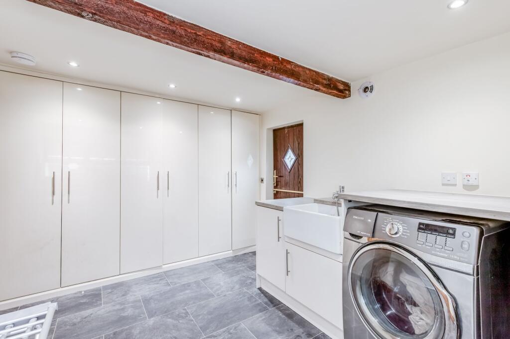 Laundry room / potential 6th bedroom
