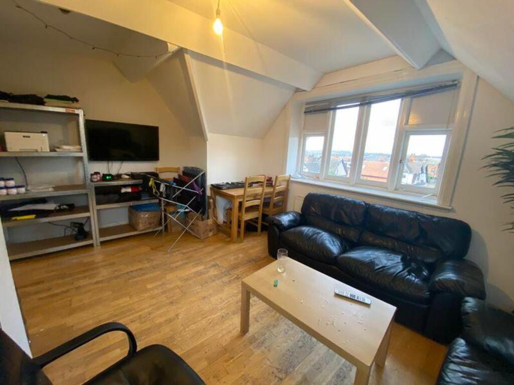 A spacious and inviting modern living room with...