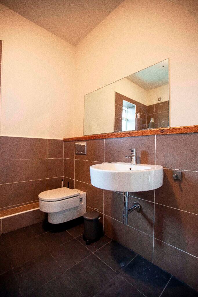 A modern and clean bathroom featuring stylish f...