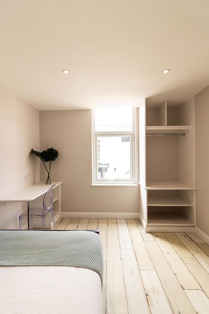 Bright and airy double bedroom featuring a larg...