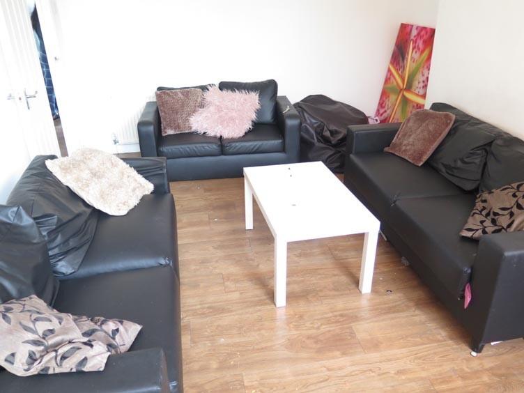 A modern, well-maintained living room featuring...