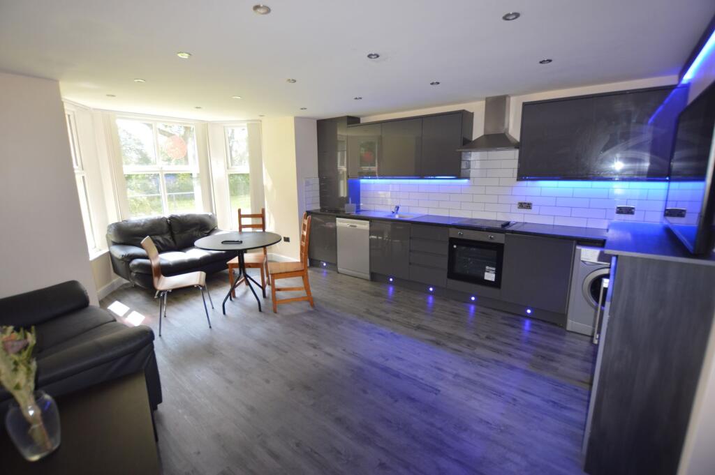 Modern and bright living room featuring large b...