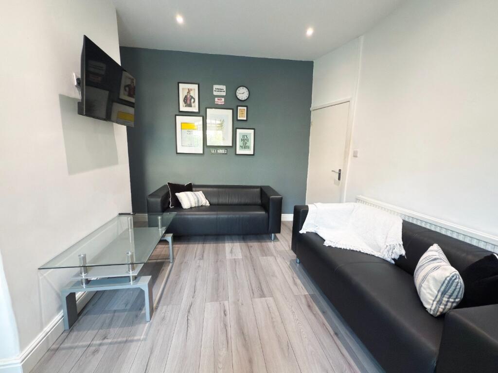 Bright contemporary living room with two black ...