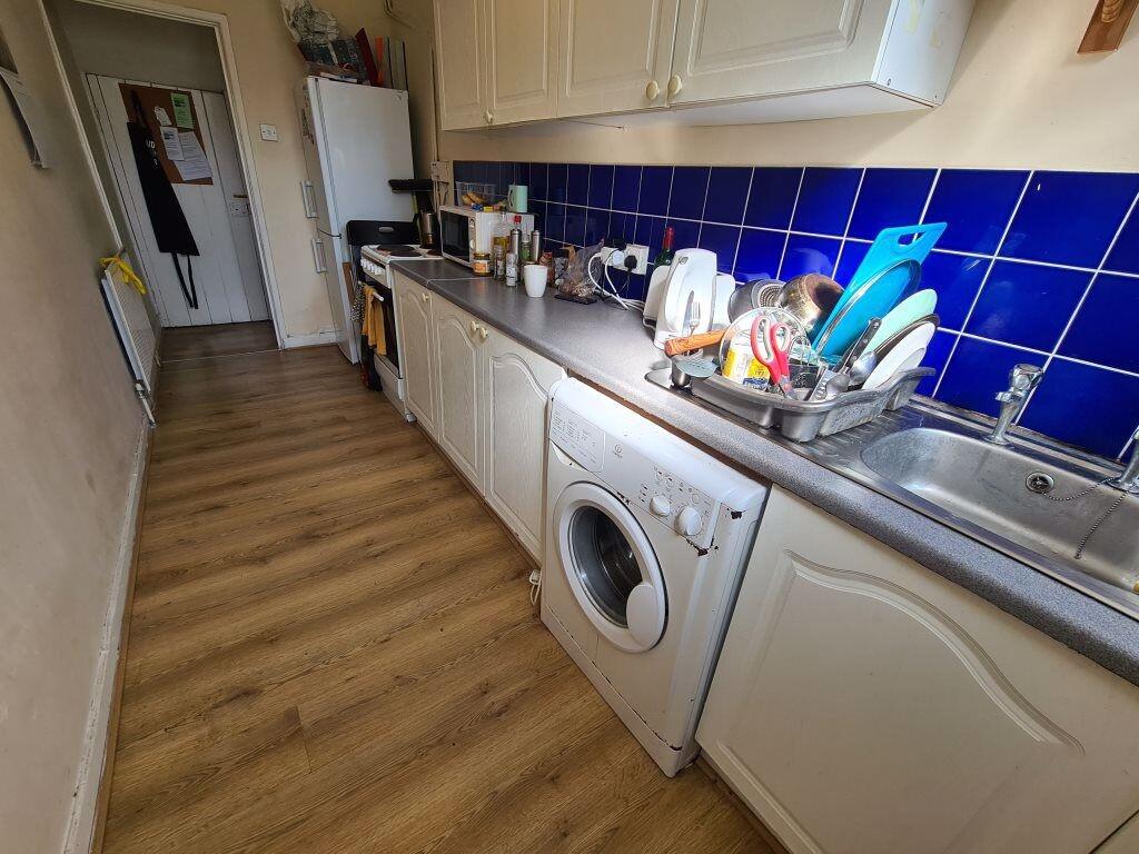 A clean and well-organized kitchen with a moder...