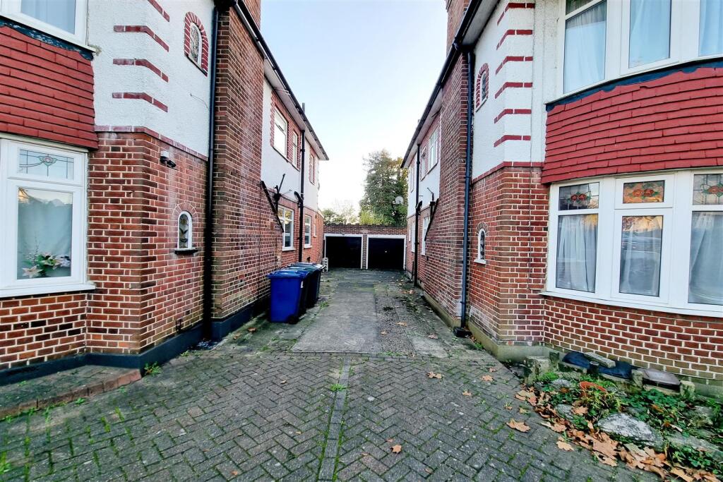 GARAGE WITH A WIDE SHARED DRIVEWAY: