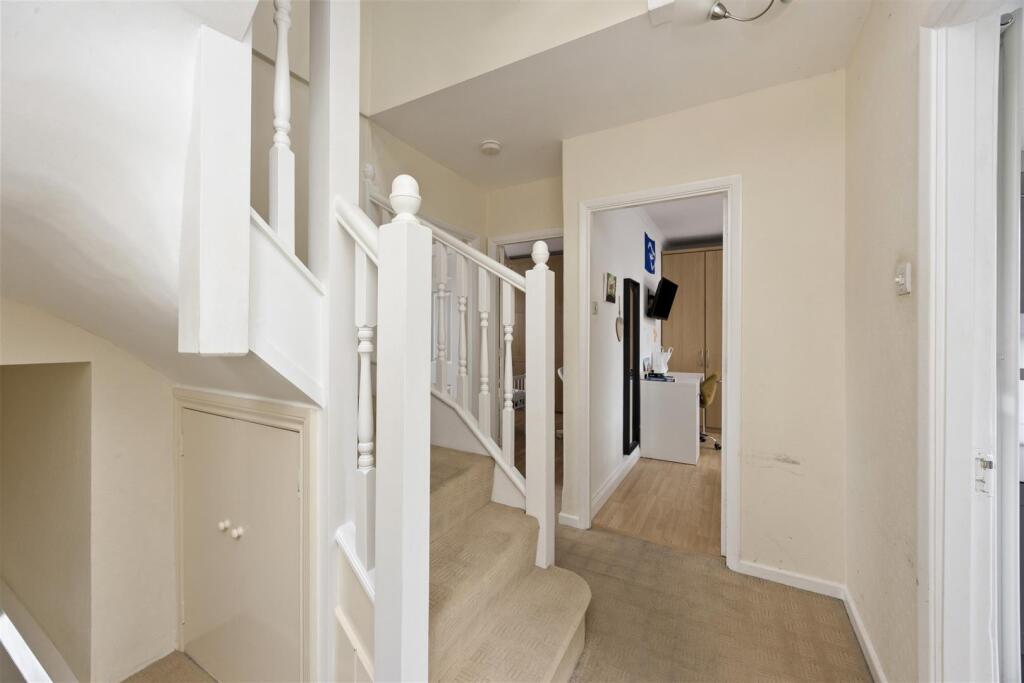 Stairs rising to Second Floor