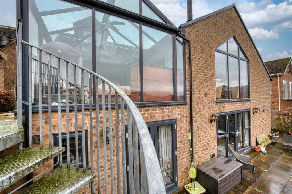 Rear of the home from spiral staircase.jpg