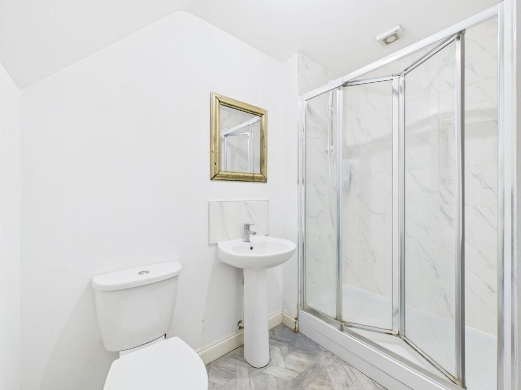 A bright and clean bathroom featuring a WC, a s...