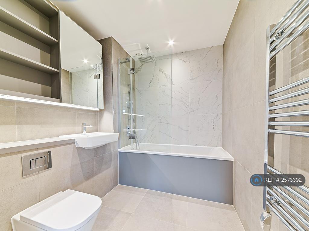 Modern Bathroom With Bathtub And Overhead Shower