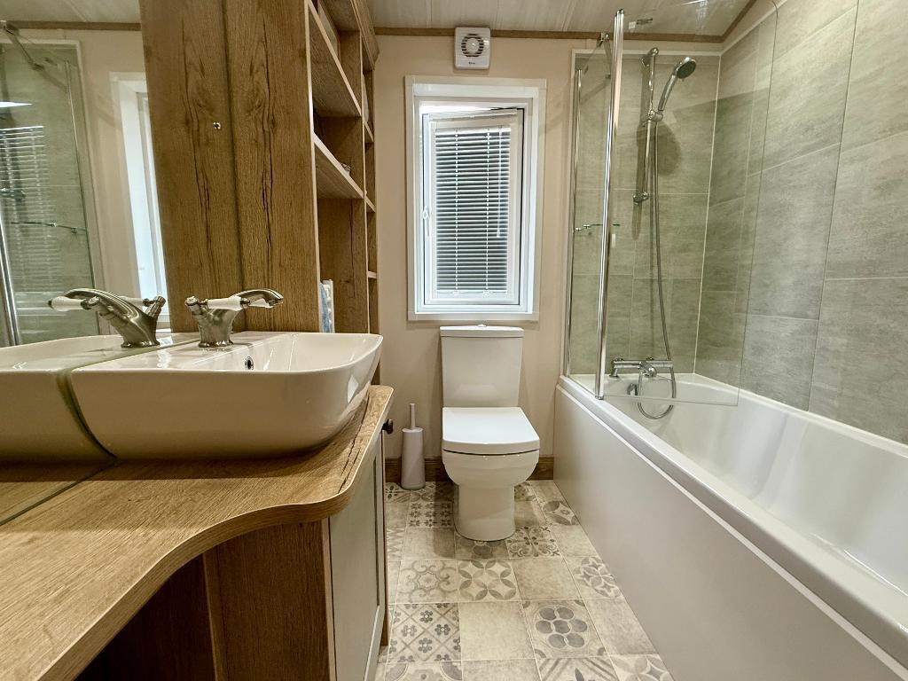 Modern bathroom with shower over